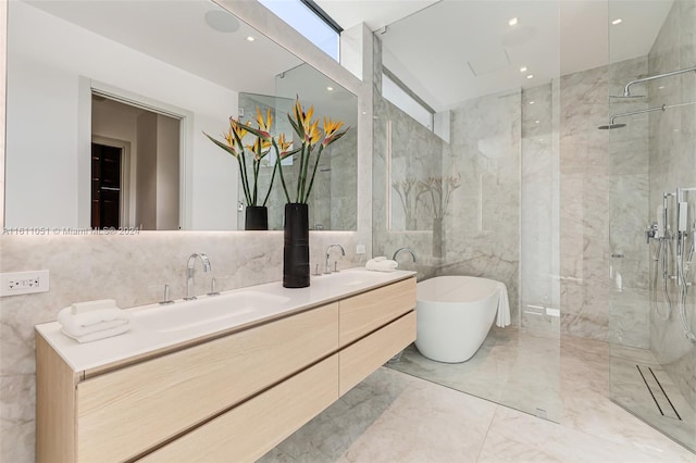 bathroom featuring tile walls, vanity, and separate shower and tub