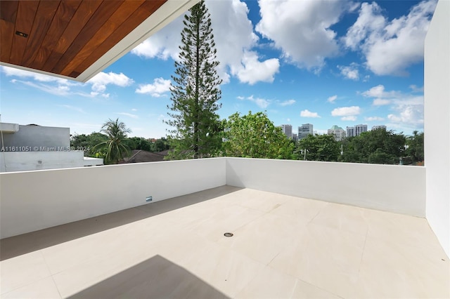 view of patio featuring a balcony