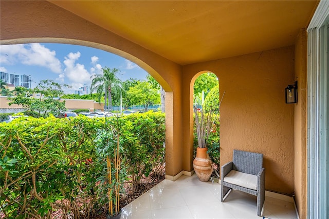 view of patio featuring a balcony