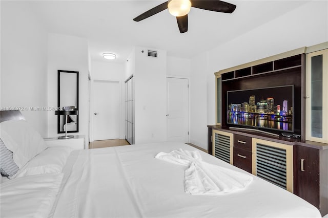 bedroom featuring wine cooler and ceiling fan