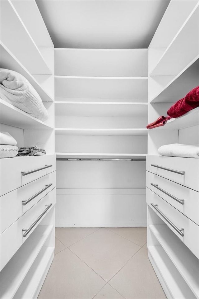 spacious closet featuring light tile patterned floors