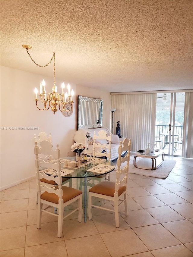 tiled dining area with an inviting chandelier and a textured ceiling