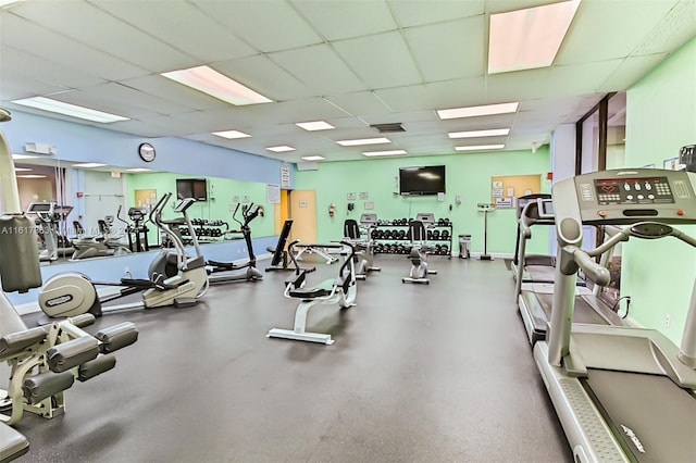 exercise room with a drop ceiling