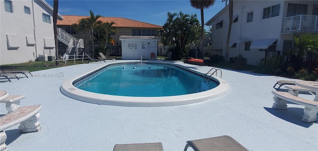 view of pool featuring a patio area