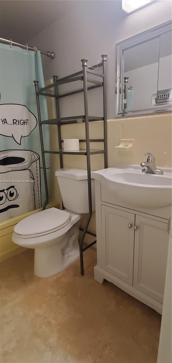 bathroom with vanity and toilet