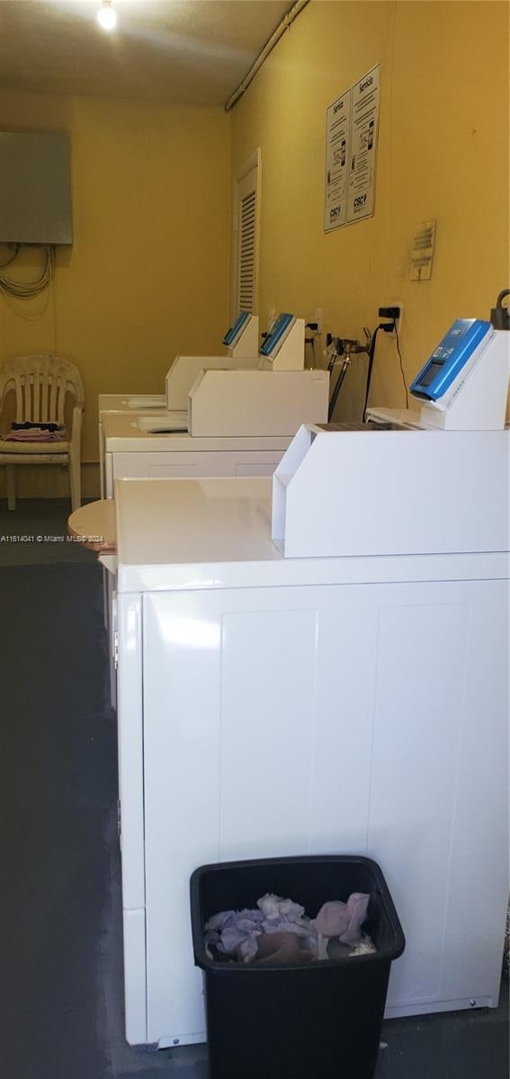 washroom with independent washer and dryer