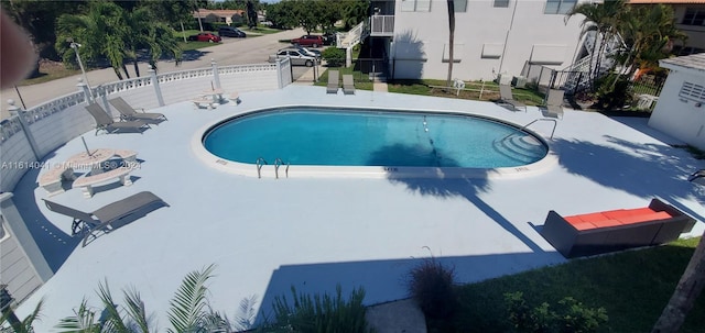 view of pool featuring a patio