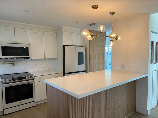 708 SE 3rd Ave Unit 201, Hallandale Beach, FL 33009 - kitchen with smart refrigerator, stainless steel electric range, white cabinets, a peninsula, and light countertops
