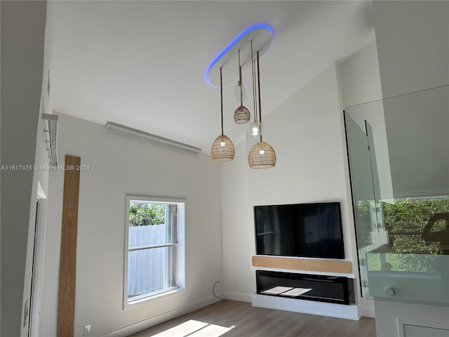 unfurnished living room with wood-type flooring