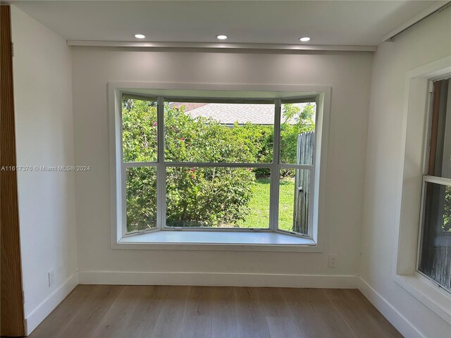 708 SE 3rd Ave Unit 201, Hallandale Beach, FL 33009 - empty room with recessed lighting, wood finished floors, and baseboards