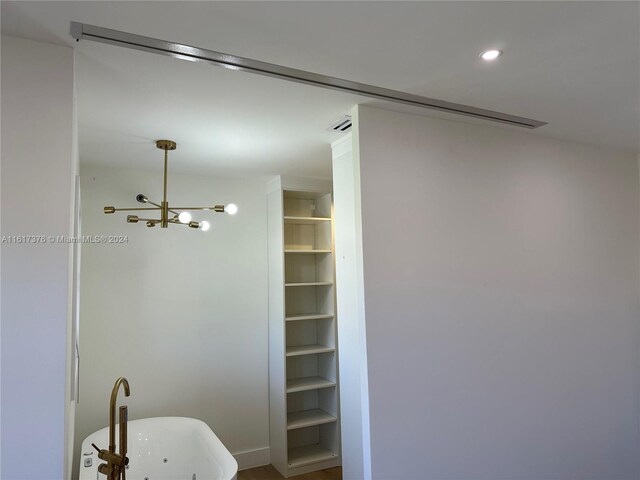 bathroom featuring a chandelier