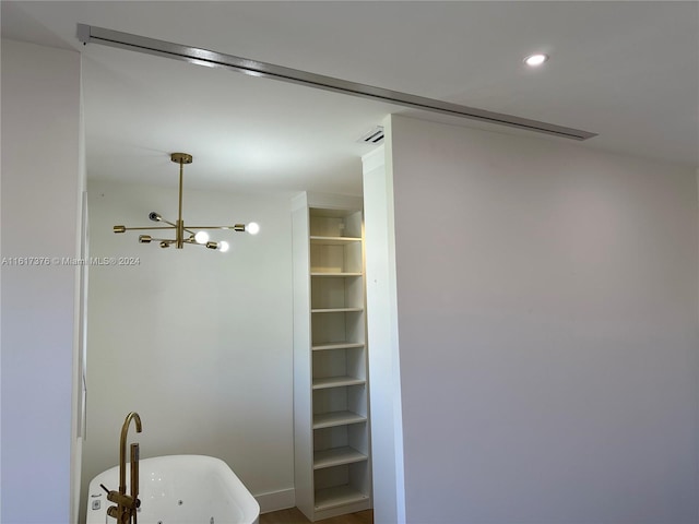 bathroom featuring a freestanding tub and recessed lighting