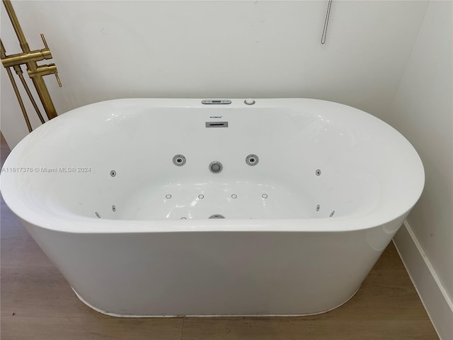 interior details with a tub with jets