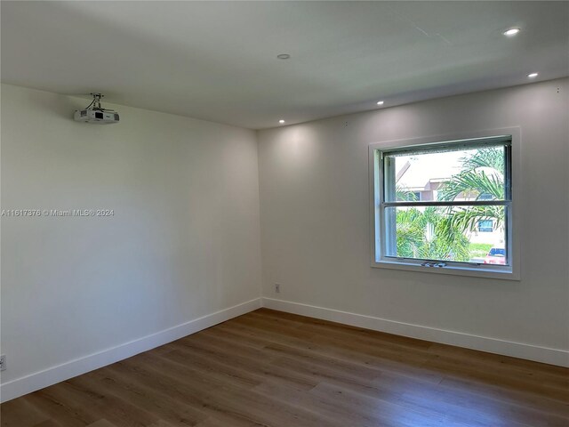708 SE 3rd Ave Unit 201, Hallandale Beach, FL 33009 - empty room featuring recessed lighting, baseboards, and wood finished floors