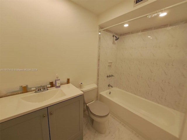 full bathroom featuring tile patterned floors, toilet, vanity, and tiled shower / bath