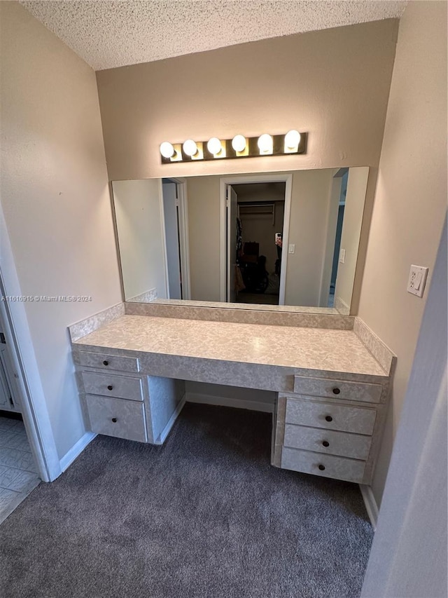 bathroom with vanity and a textured ceiling