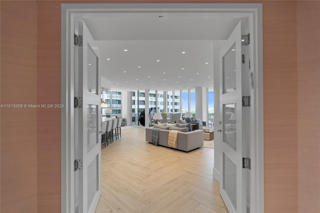 dining space with light hardwood / wood-style flooring and expansive windows