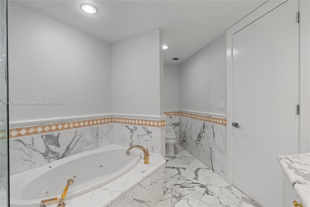 bathroom with a relaxing tiled tub and toilet