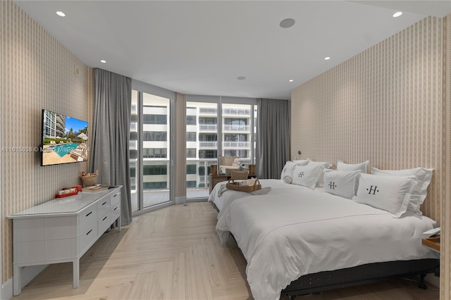 bedroom featuring access to exterior and light parquet flooring