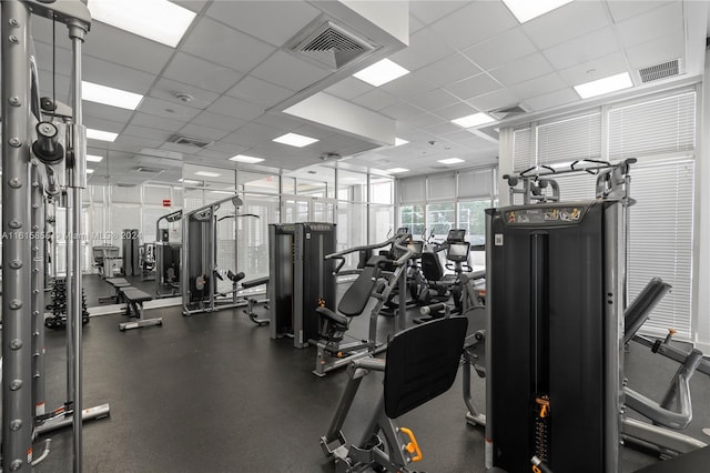 exercise room featuring a paneled ceiling