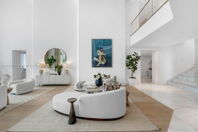 living room featuring a high ceiling and light tile patterned floors