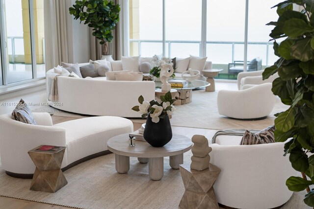 living room with a wall of windows and plenty of natural light