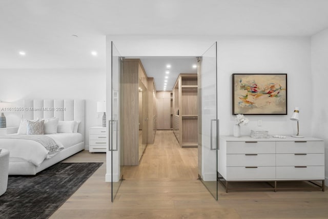 bedroom with light hardwood / wood-style floors