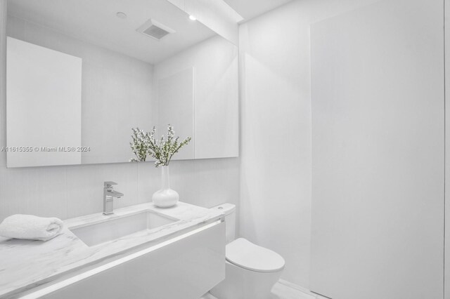 bathroom featuring sink and toilet