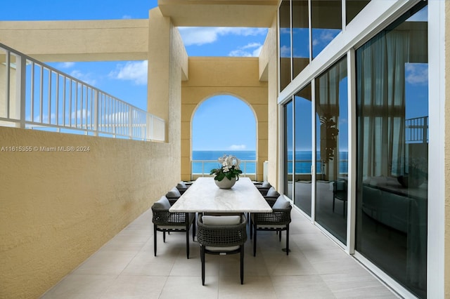 balcony featuring a water view