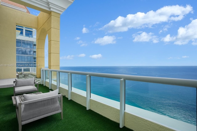 balcony featuring a water view