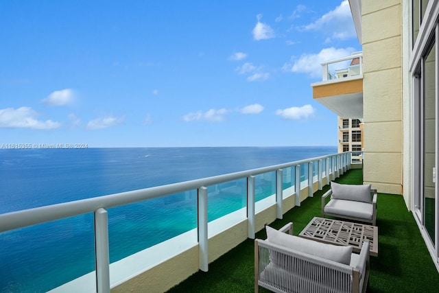 balcony featuring a water view