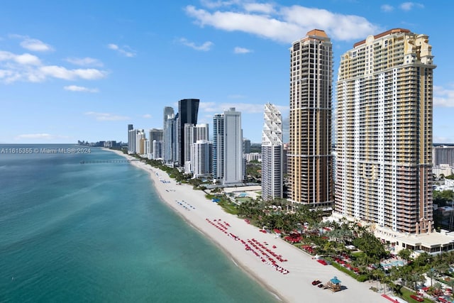 aerial view featuring a water view and a view of the beach