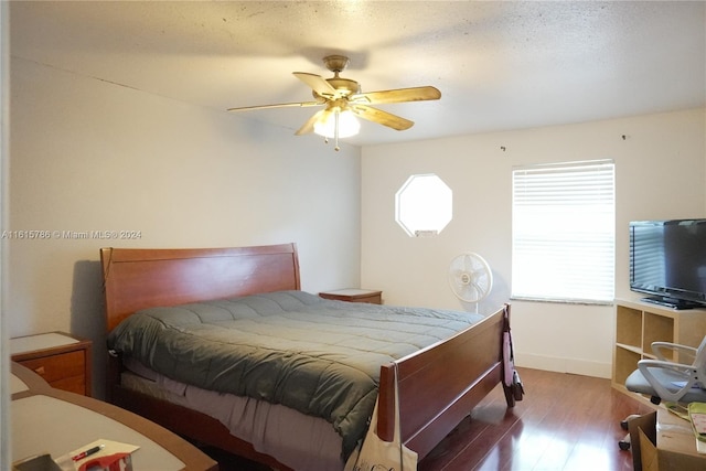 bedroom featuring wood-type flooring and ceiling fan