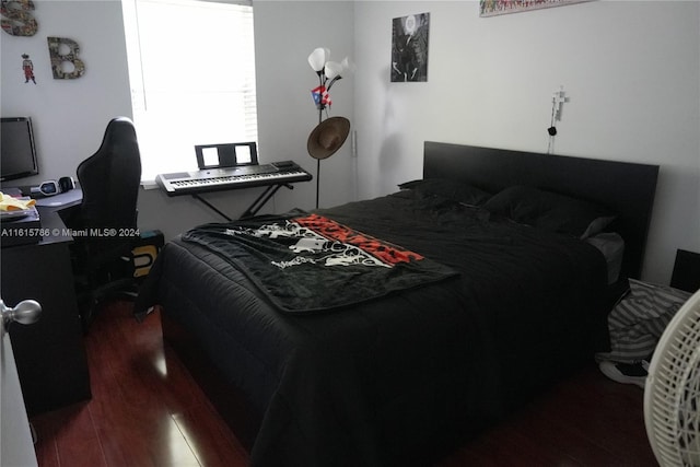 bedroom featuring dark hardwood / wood-style flooring