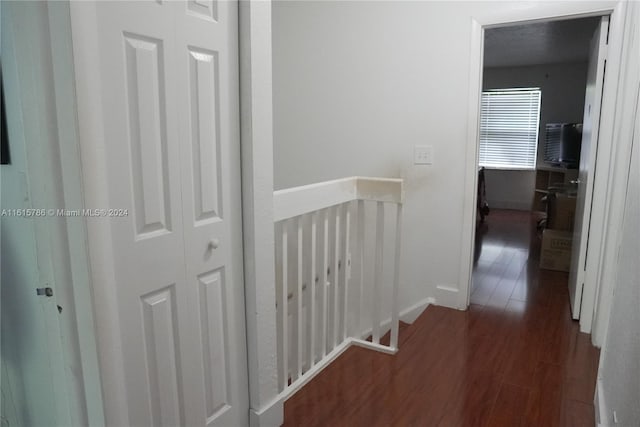 hall with dark hardwood / wood-style flooring