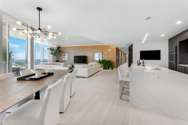 dining space with a chandelier and light tile patterned floors