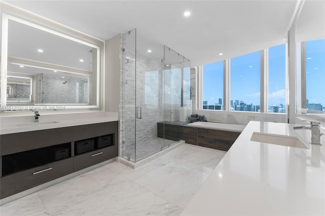 bathroom featuring independent shower and bath, tile patterned floors, and vanity