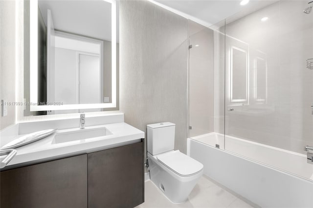 full bathroom featuring tile patterned floors, toilet, enclosed tub / shower combo, and vanity