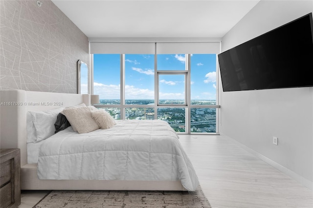 bedroom featuring light wood-type flooring