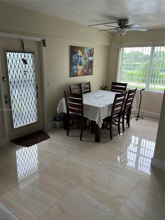 hall with tile patterned floors