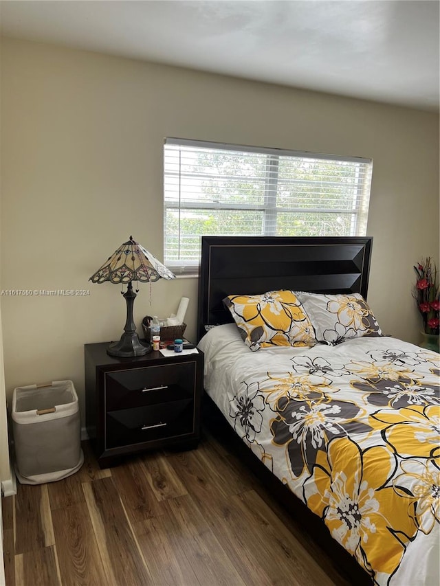 bedroom featuring dark hardwood / wood-style floors