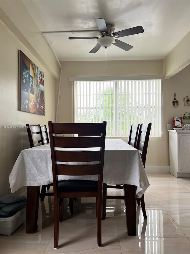 dining area featuring light tile patterned flooring and ceiling fan