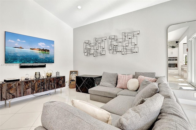 tiled living room featuring lofted ceiling