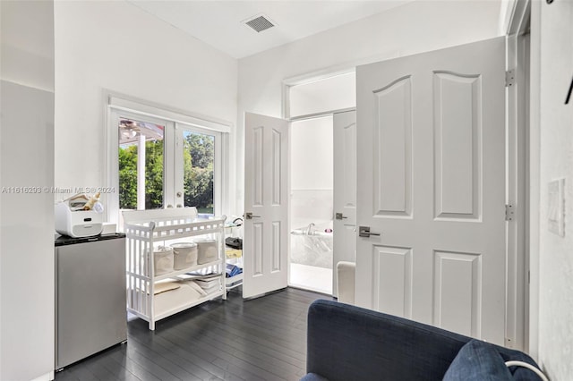 interior space with french doors and dark wood-type flooring