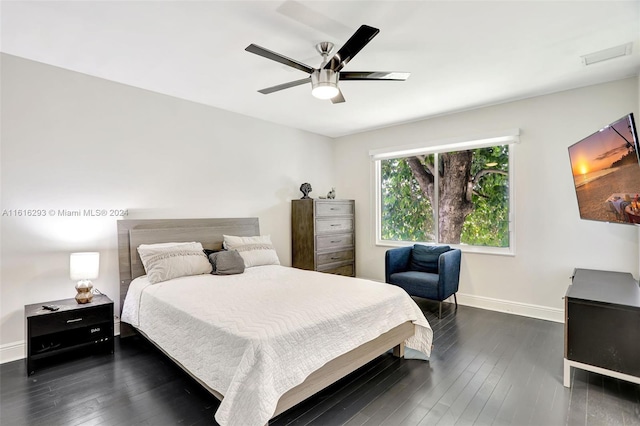 bedroom with ceiling fan and hardwood / wood-style flooring