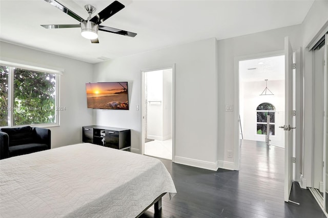 bedroom with ceiling fan, a closet, wood-type flooring, and ensuite bathroom