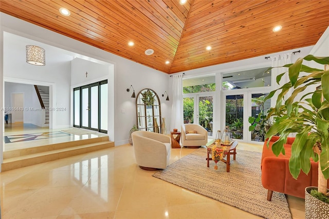 living room featuring french doors, high vaulted ceiling, and wooden ceiling