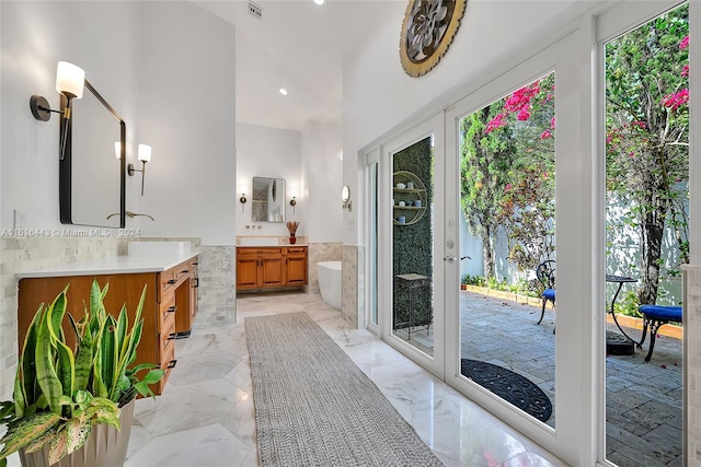 bathroom featuring french doors and vanity