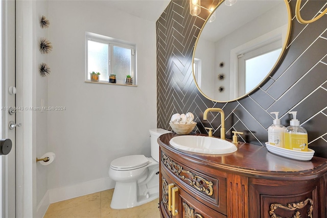 bathroom with tile patterned floors, vanity, and toilet