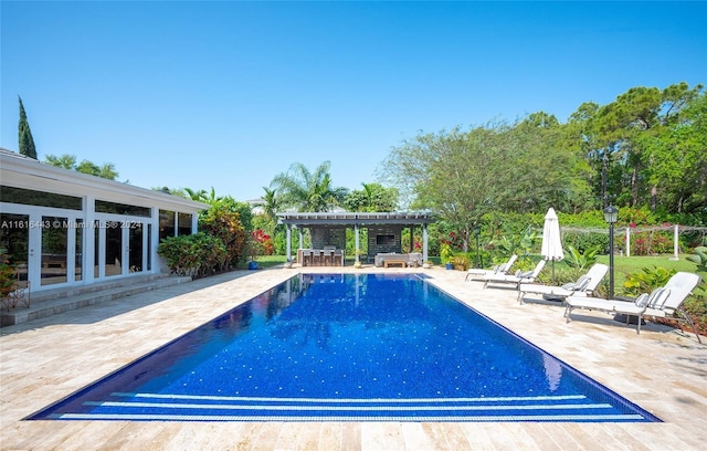 view of swimming pool with a patio area